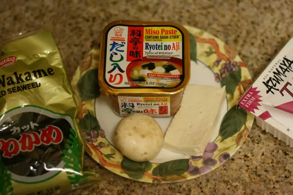 soup ingredients: wakami, miso paste, and tofu
