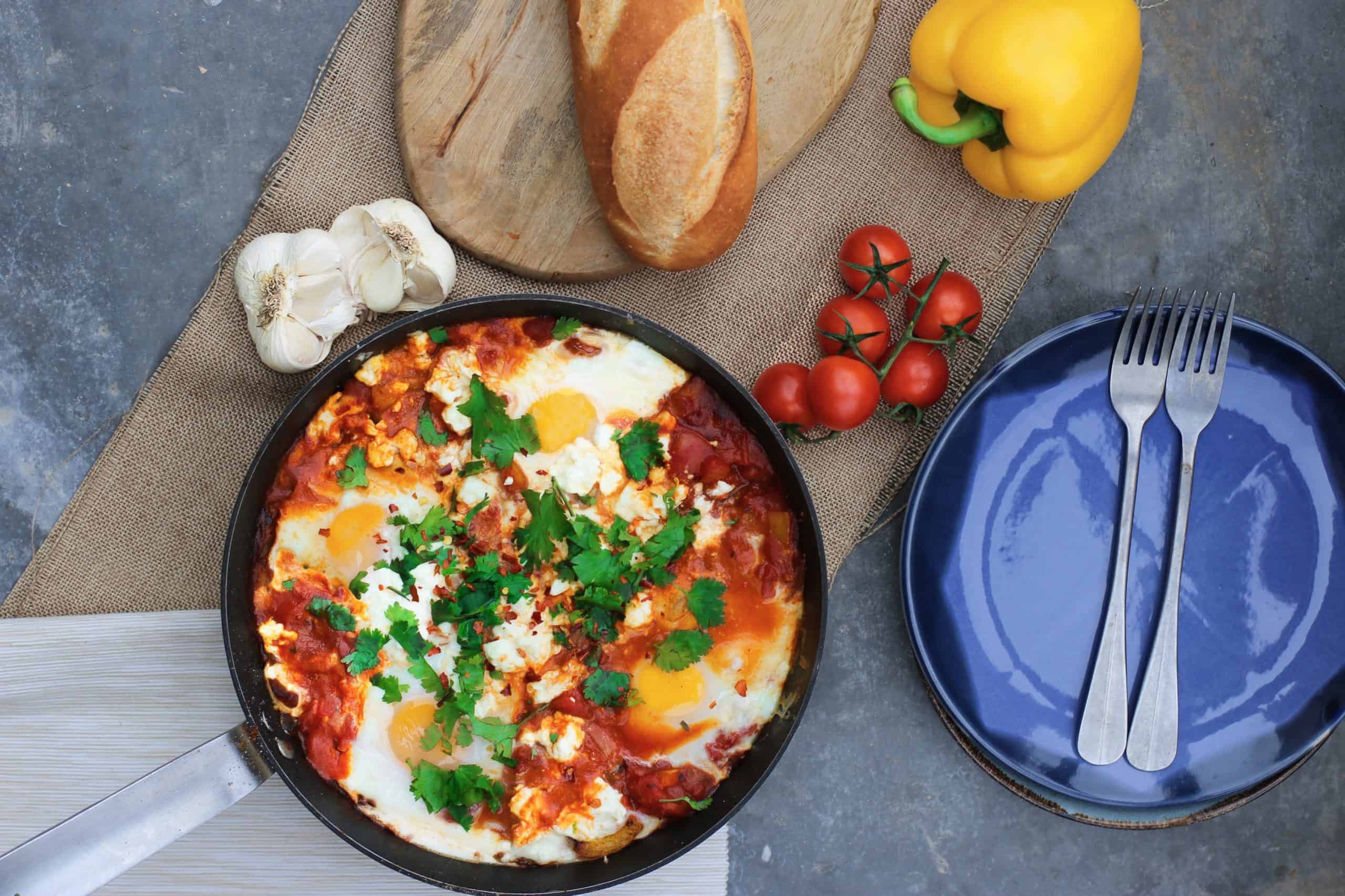 a flat-lay photo of omelette and other dish beside it