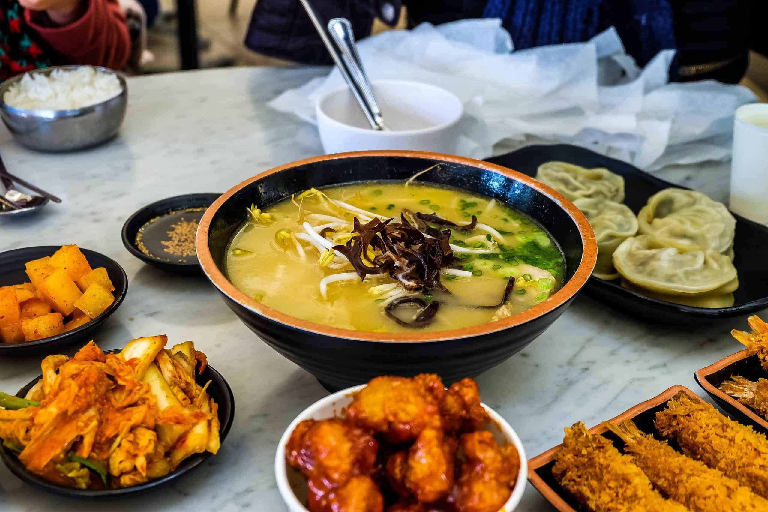 kimchi and several other food as ramen side dish