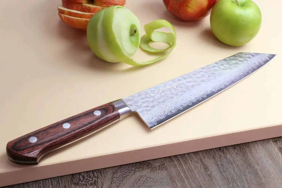 Best modern construction kiritsuke knife- Yoshihiro VG-10 Knife on cutting board