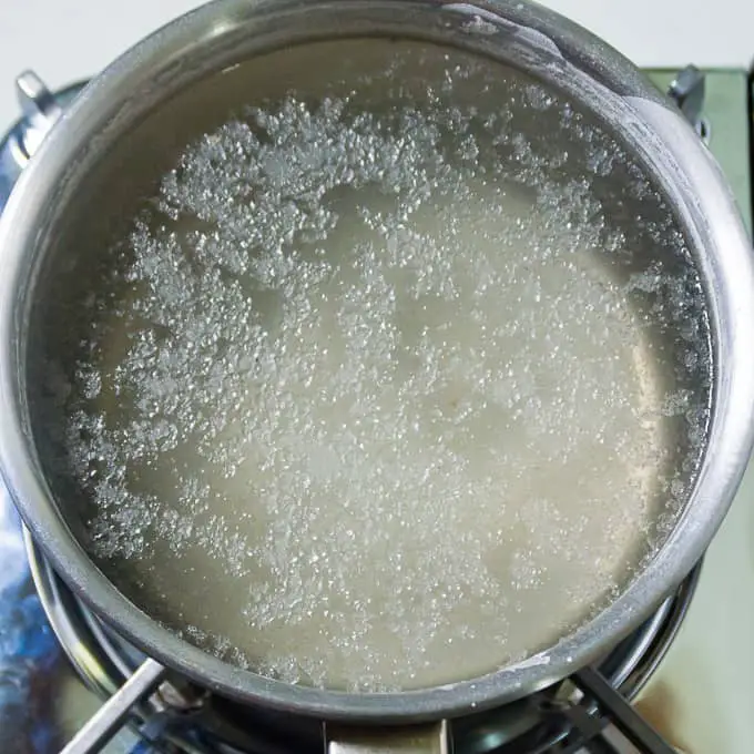 Boil salt and water in pot