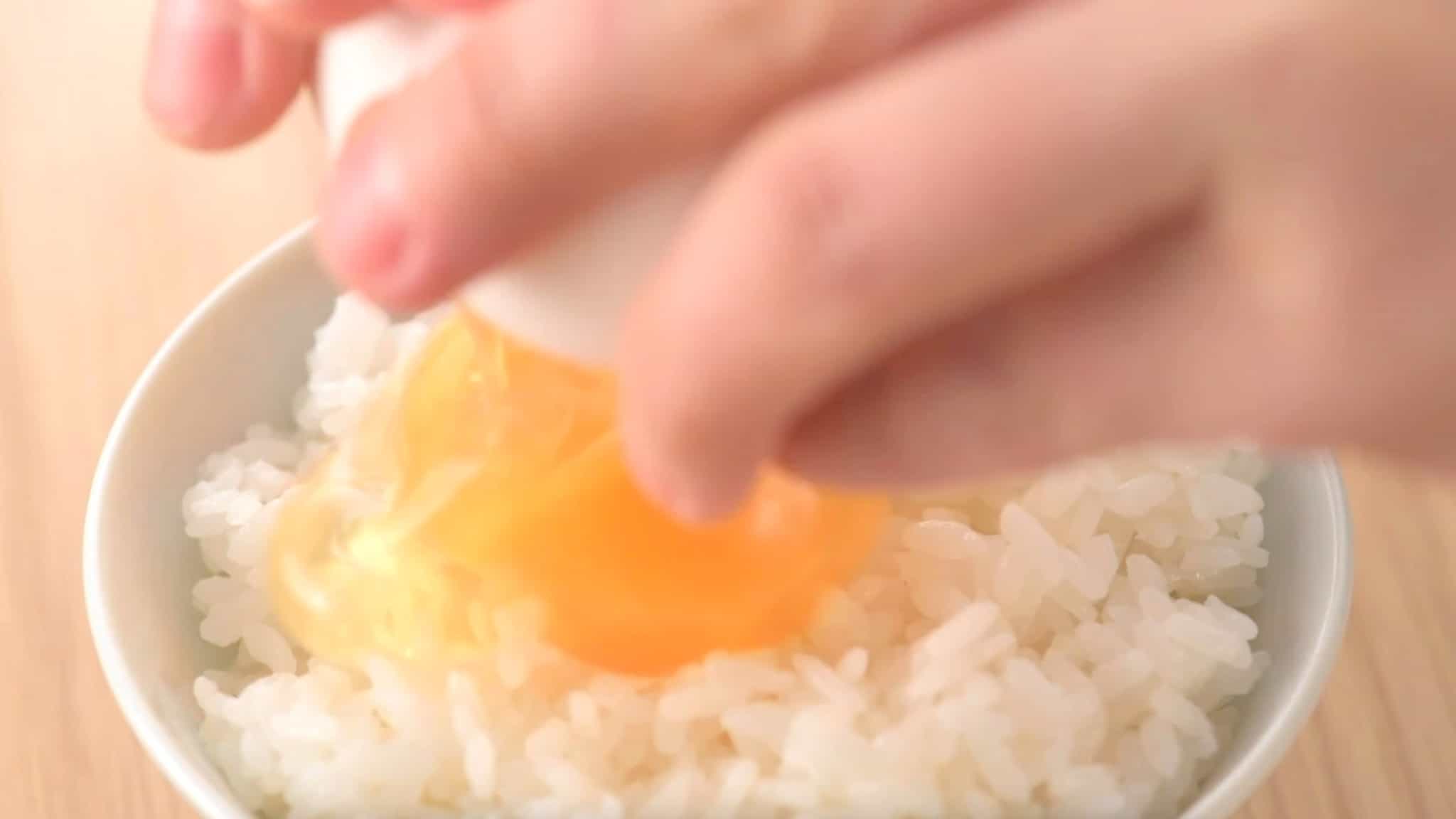 Why do Japanese people put raw eggs on their rice