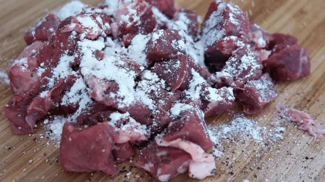 Add a light coat of flower to the cubed beef