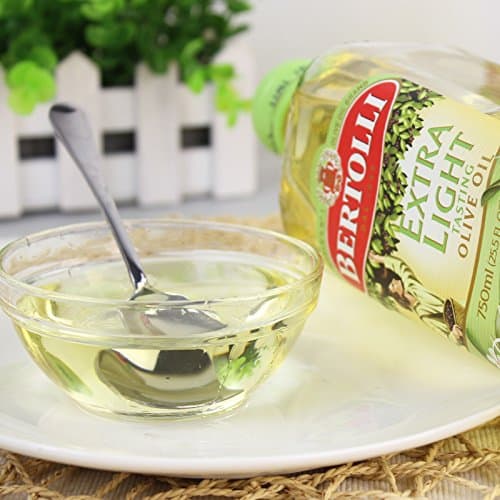 Utilisez l'huile d'olive extra légère Bertolli comme substitut de l'huile de sésame