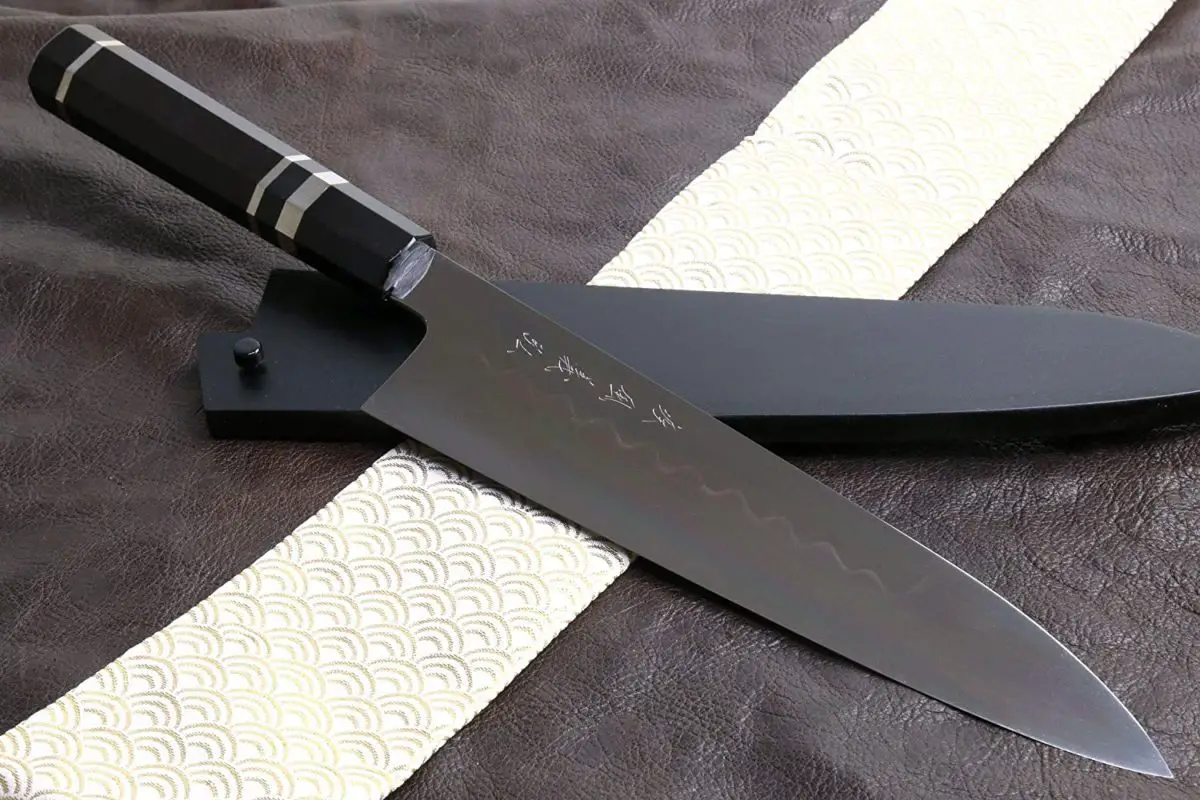 Best Honyaki Gyuto knife- Yoshihiro Mizu Yaki Honyaki Shiroko on table