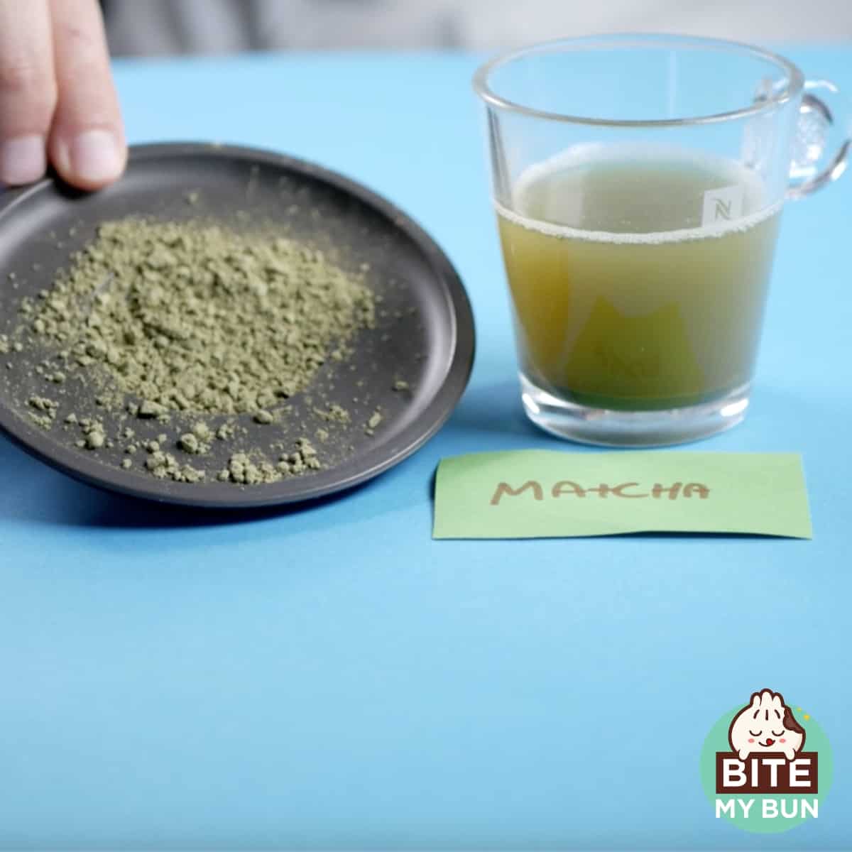 Cup of Matcha tea and powder on a table